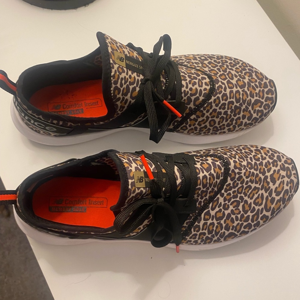 New Balance leopard slip on sneakers.